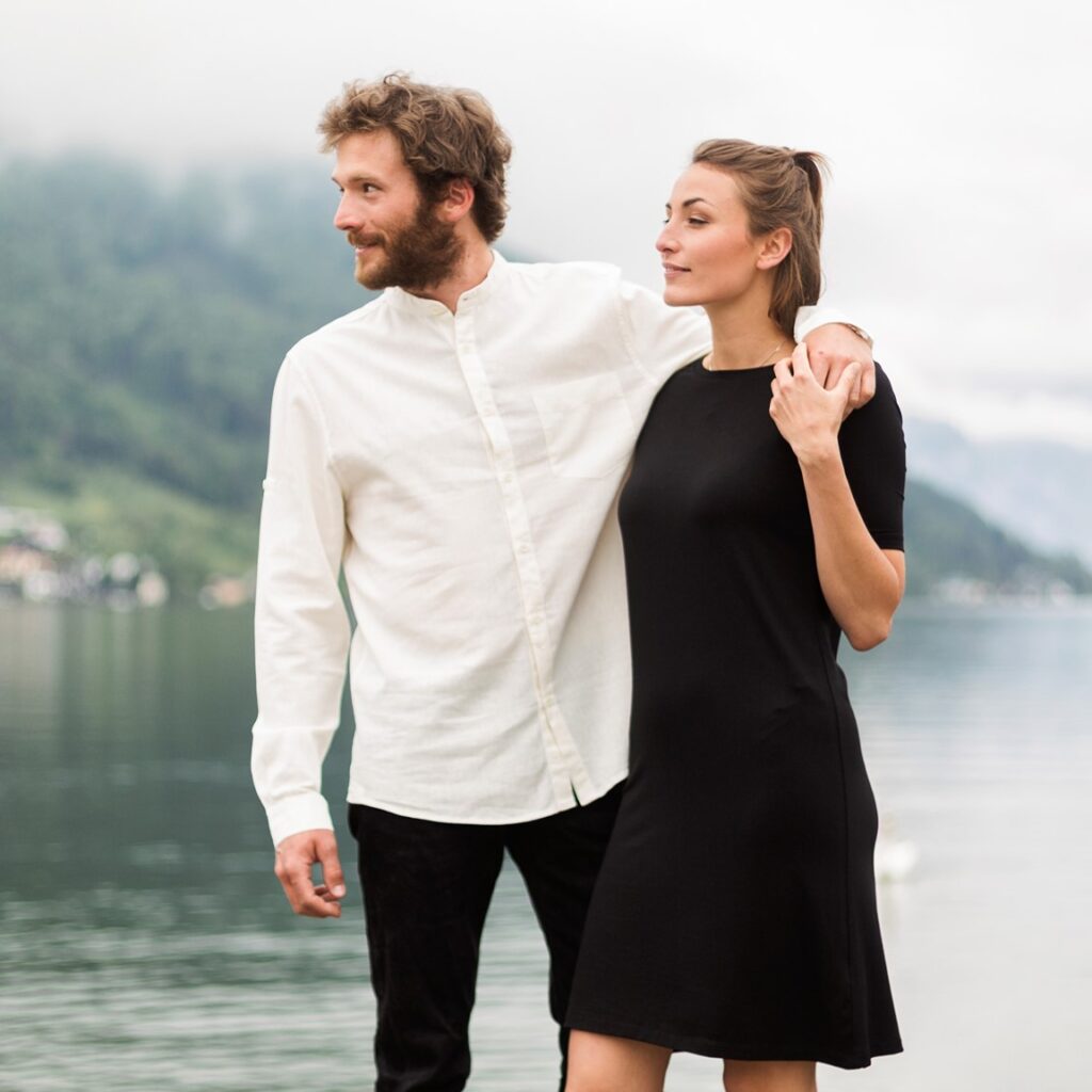 Male and female models wearing Zerum's white button up shirt and black T-shirt dress