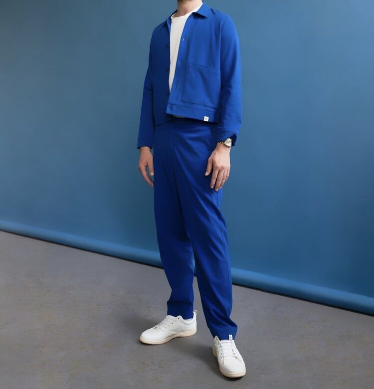Male model wearing blue pants and a blue jacket from SILFIR