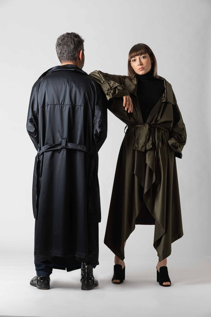 Two models wearing long black and brown/green coats from sustainable brand ZEROBARRACENTO