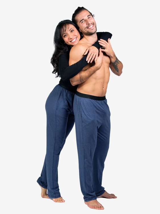 Male and female model both wearing blue lounge pants from sustainable brand Saint Basics