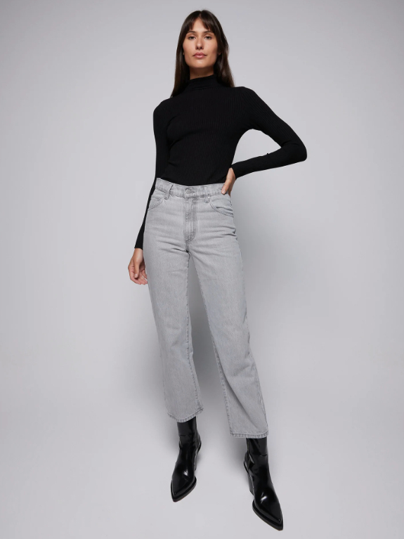 Model wearing grey cropped straight legged jeans and black turtleneck sweater from Nobody Denim with black heeled boots