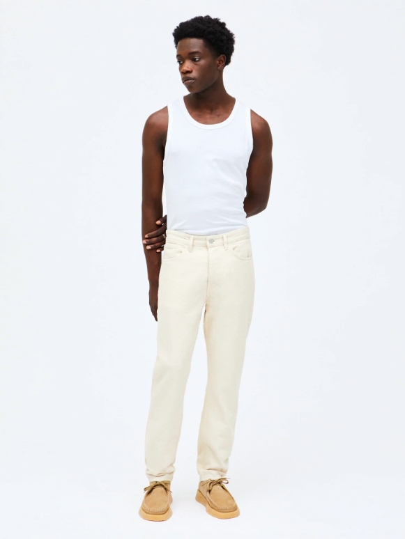Model wearing off-white jeans from sustainable brand HNST